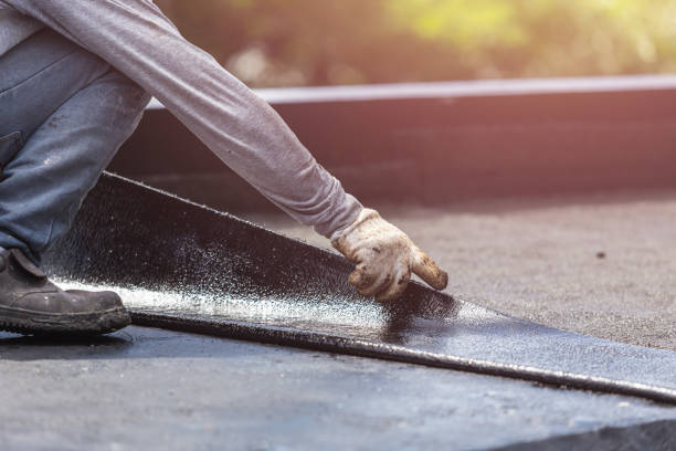 Professional Waterproofing technician working in Kensington, MD